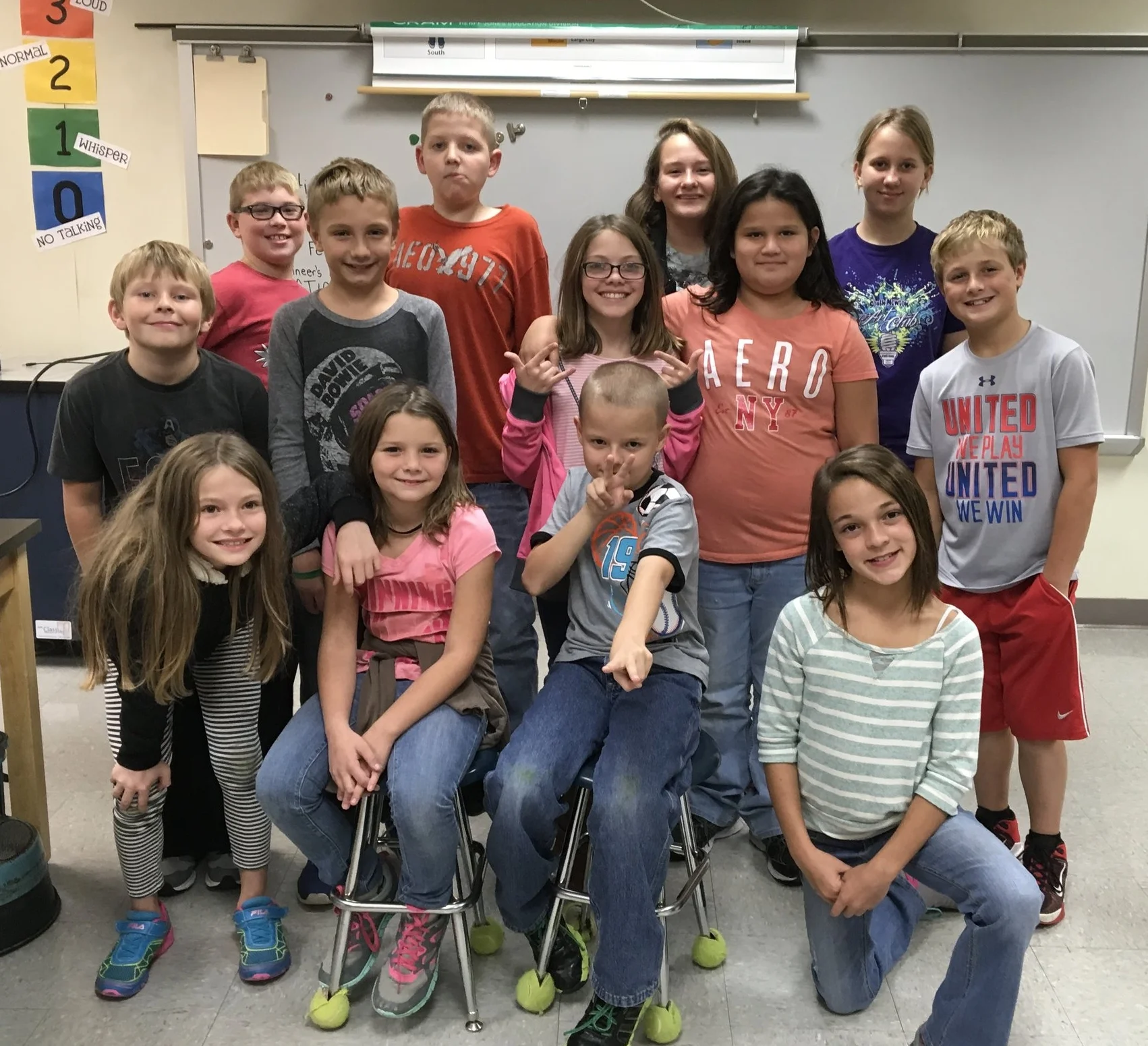 South Newton VEX IQ team poses for a team picture. Even though they didn't feel ready for their first competition, the event taught the team so much and really brought them together!