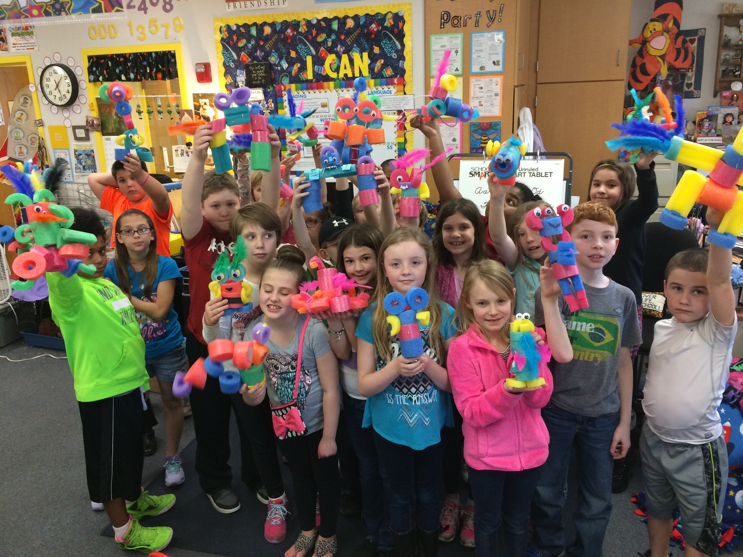 Students from West Newton Elementary School on the south side of Indianapolis show of their classroom projects.