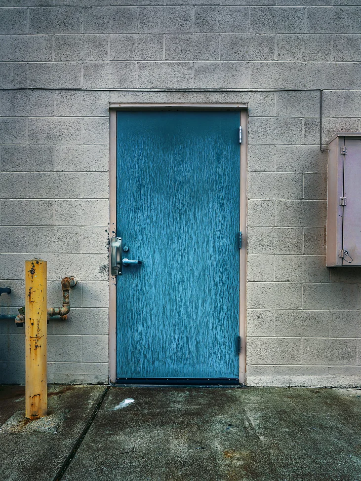 |#39| Bondi Blue Streaking dirt and water form a bark-like texture. Rust bleeds and seeps from metal pipes and parking post. Butterfly hinges abound.