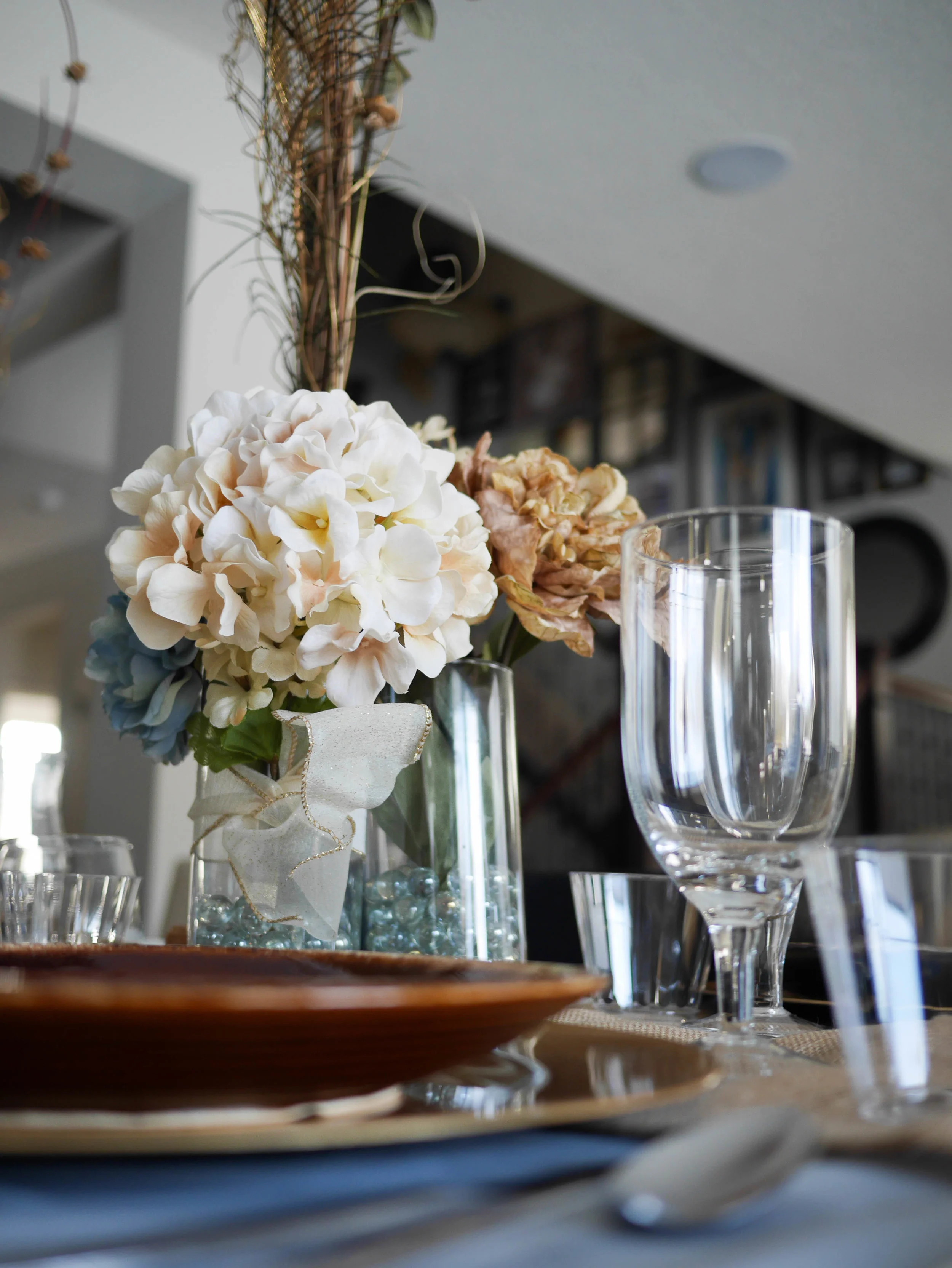 Try setting out a variety of different glassware. It adds interest to the decor and guests can pick a glass that suits whatever they're drinking without having to search through your cabinets to find one.&nbsp;