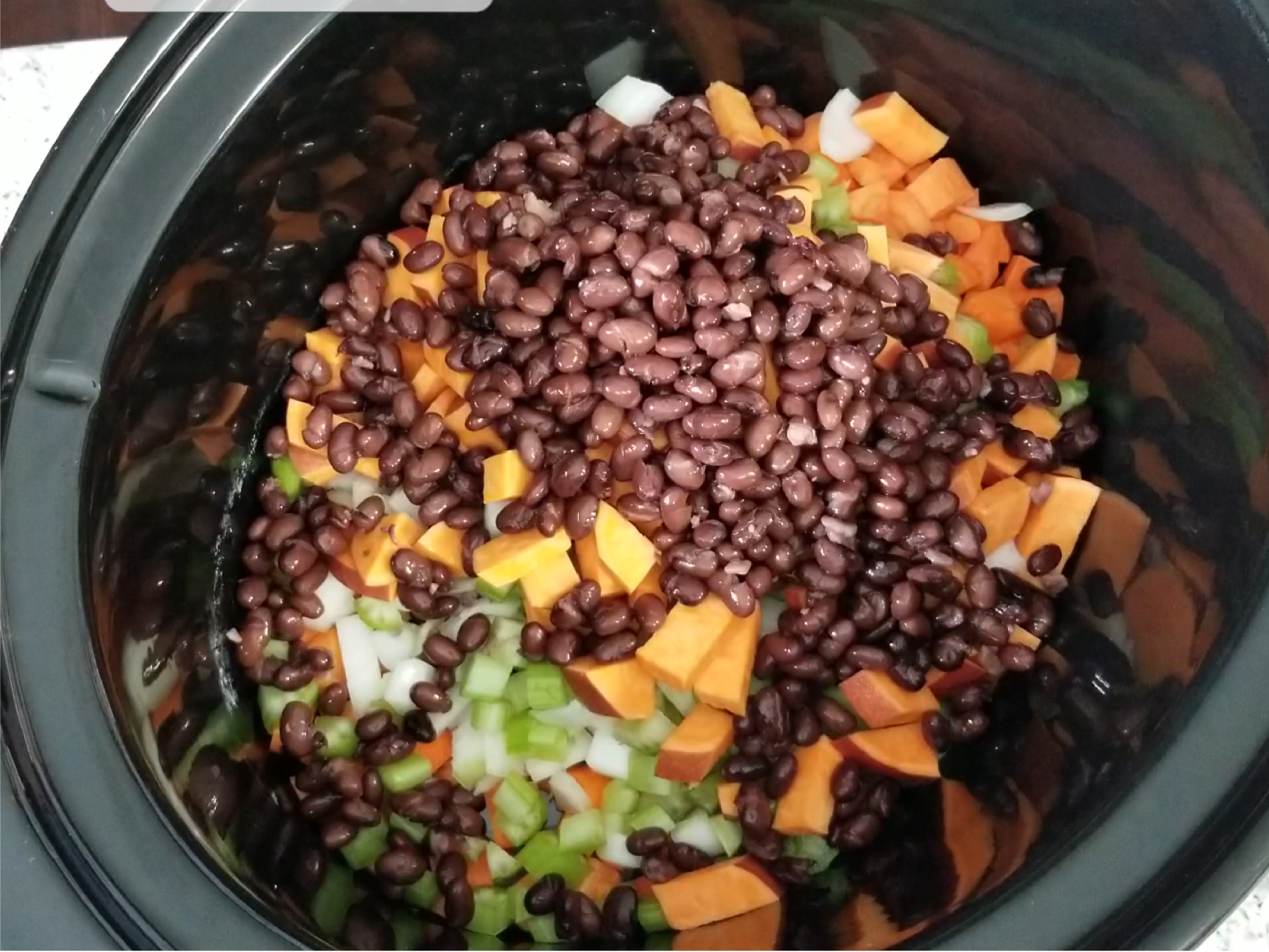 Dump vegetables into the slow cooker.