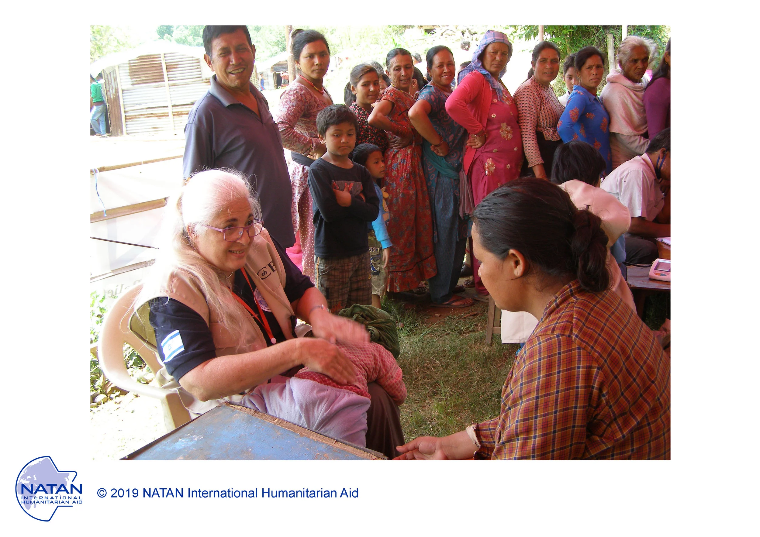 nepal 2015 - natan nurse performing assessments of earthquake survivors in nepal