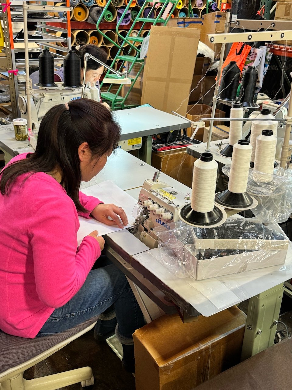  One of Rickshaw’s seamstresses sews the bag together, adding a strap and Rickshaw Bagworks tag. 