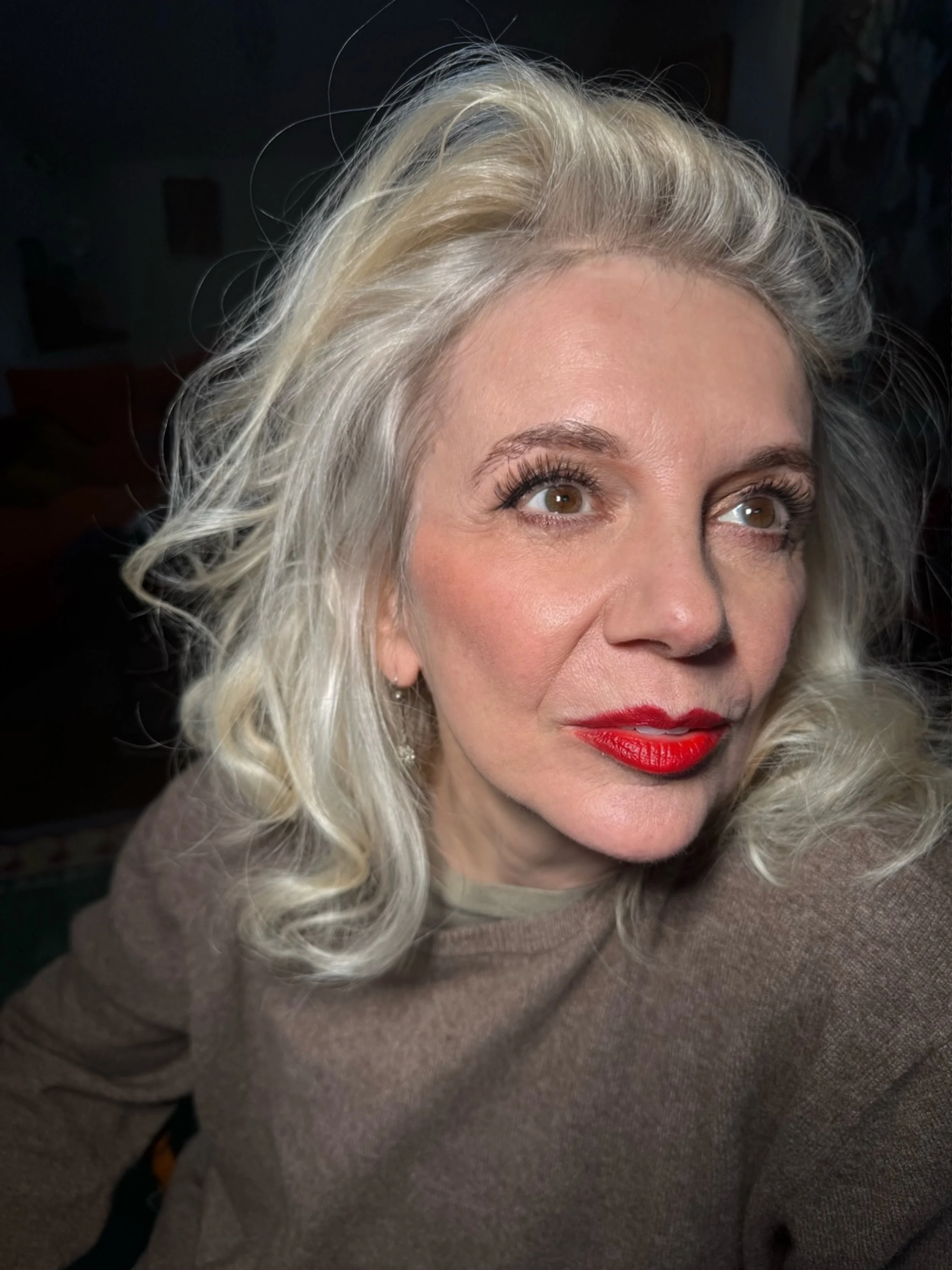 tracy-coleman-portrait-platinum-curls-red-lips-direct-gaze.jpeg