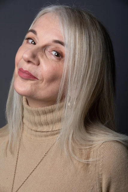 tracy-coleman-studio-portrait-turtleneck-warm-smile-grey.jpeg