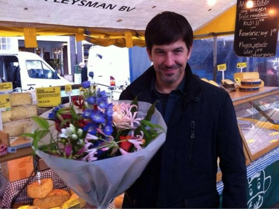 #throwbackthursday #22 - Nov 10, 2010 in Amsterdam: Remember Tim and I getting into some silly argument in the morning that just escalated. Later while quietly shopping for some stinky cheese he disappeared (which pissed me off even more). He showed up with a beautiful peace offering. You can tell by his eyes and grin he's like, "I'll let you be right... but just this once." #rememberingtim