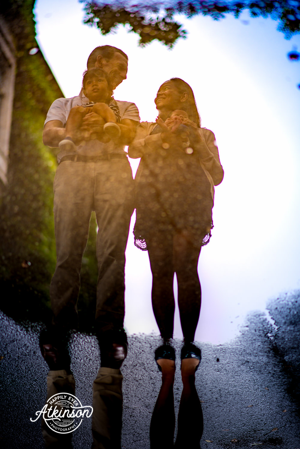 family portrait reflected in puddle