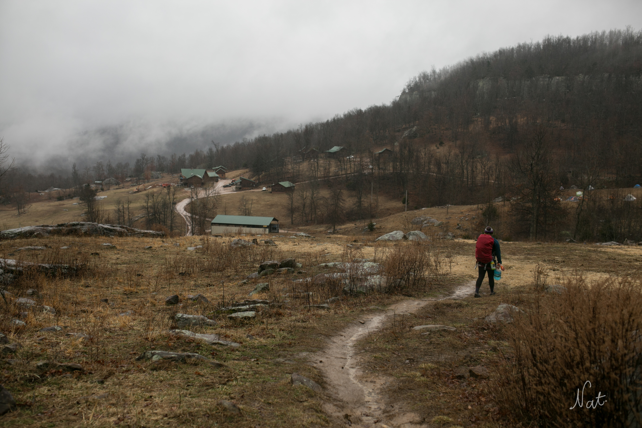 Kayla walked back to the camp. It was raining.
