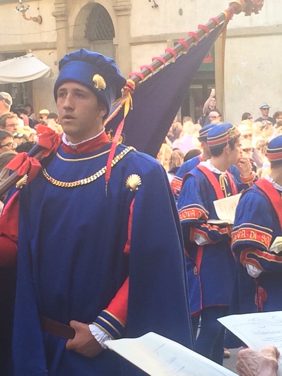 Palio is starting...men in these blue outfits and tights with flags and drums marched around the city all day long with people following them through town. It was a festive first day in town for me.