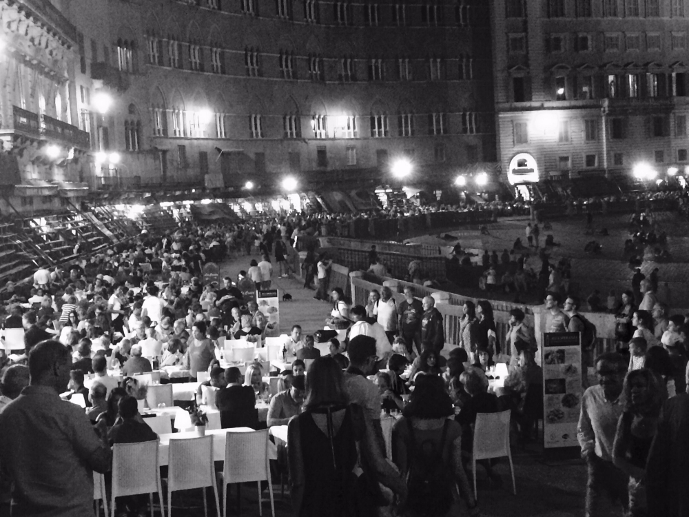 Piazza del Campo at night. Dirt covers the ground and the restaurants set their tables on it. I love walking on the dirt for some reason...I find it comforting.
