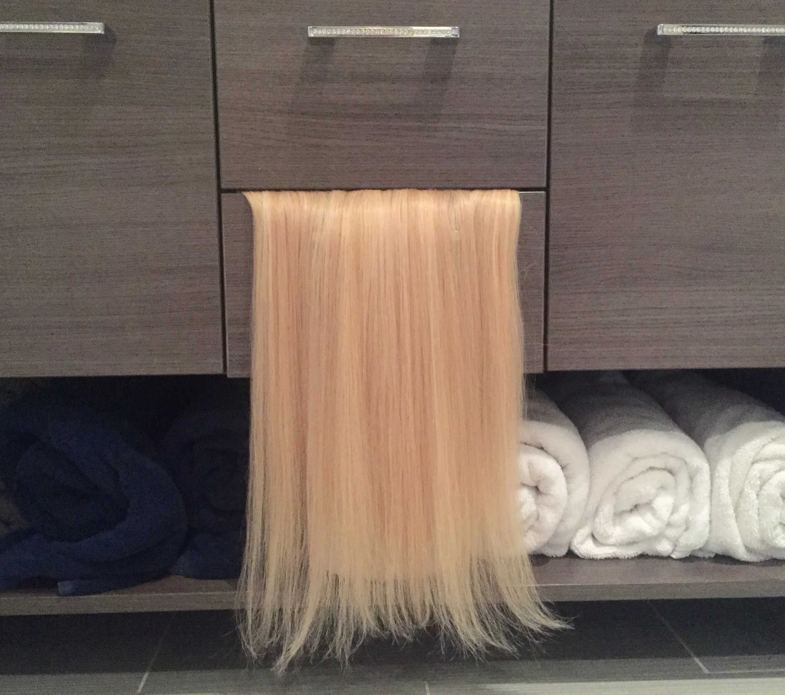 Brush them out with the drawer closed. Then spray them with water.