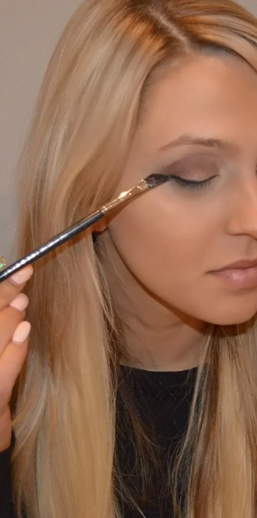 Then using your angled brush and the colour 'blackout' draw a thin line above your lashes, from the middle of your eye to the outside corner, then from the inner corner of your eye, meeting up the the colour in the middle. I then apply a light coat of Loreal voluminous mascara, and then my favourite Ardell lashes in 'wispies.' Then I go over my lash line one more time with my liner brush and black powder so the lash strip is covered. Don't forget your brows! I use an amazing twist up brow pencil in 'caramel' by Anastasia Beverly Hills.