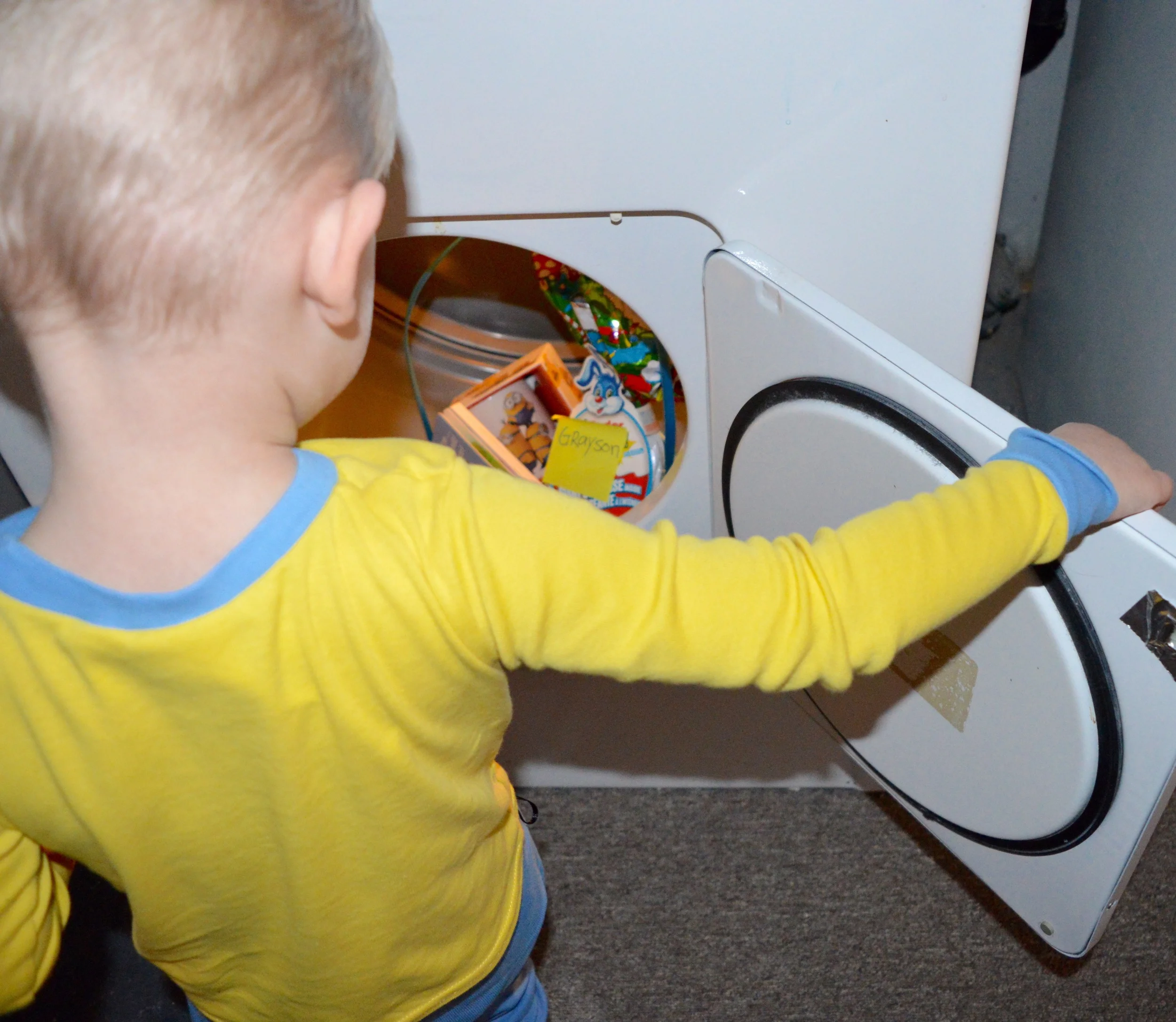 Finding his basket in the dryer! He was so happy! He got his own minions cup for hot chocolate a new book and his favourite things right now in the large size- kinder egg surprise!!ย