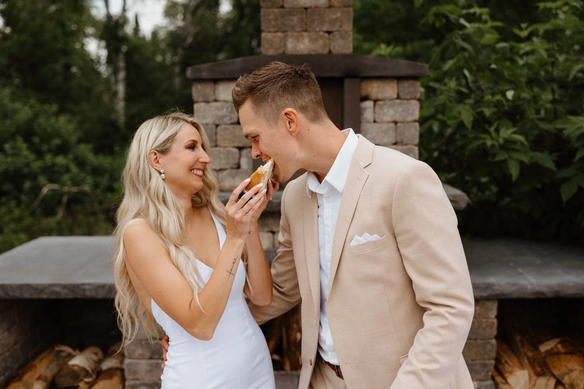 Bride and groom eating cake.jpg