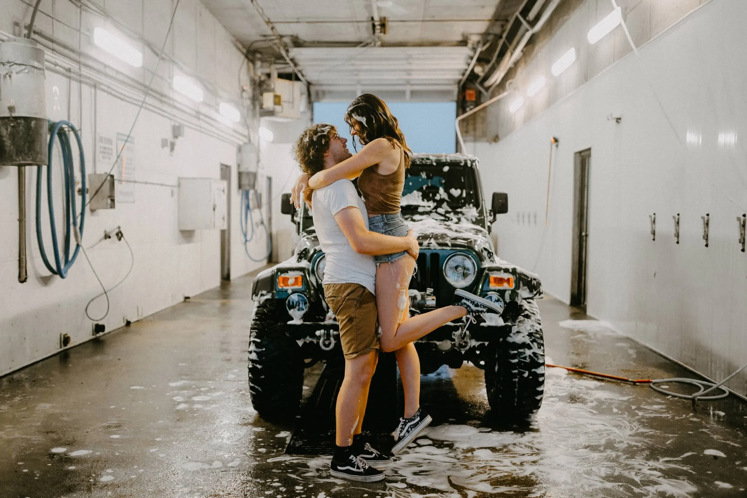 winnipeg-engagement-session-couple-car-wash-fun.jpeg