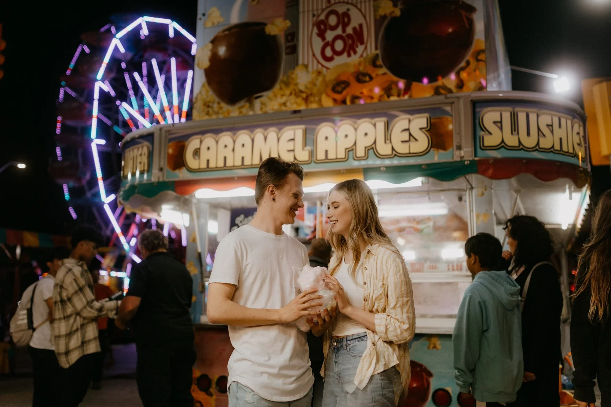 winnipeg-engagement-session-fair-night-candid.webp