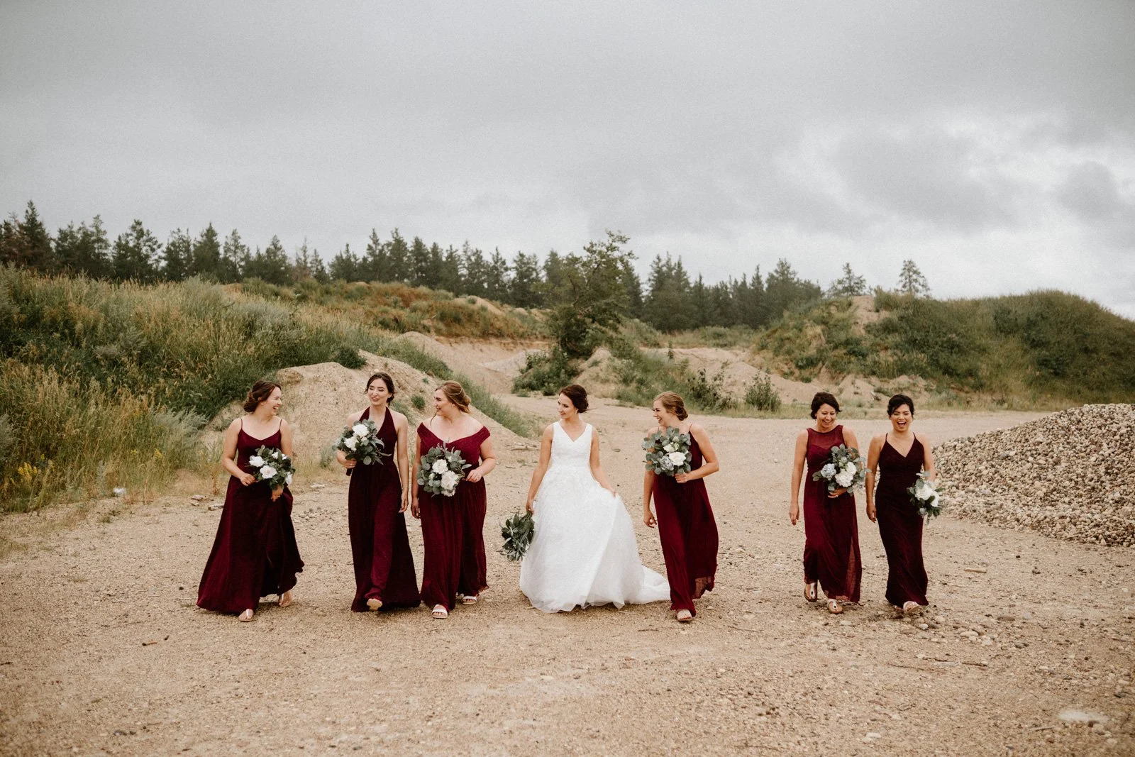  Bride and bridal party walking through Sandilands Provincial Forest in southern Manitoba 