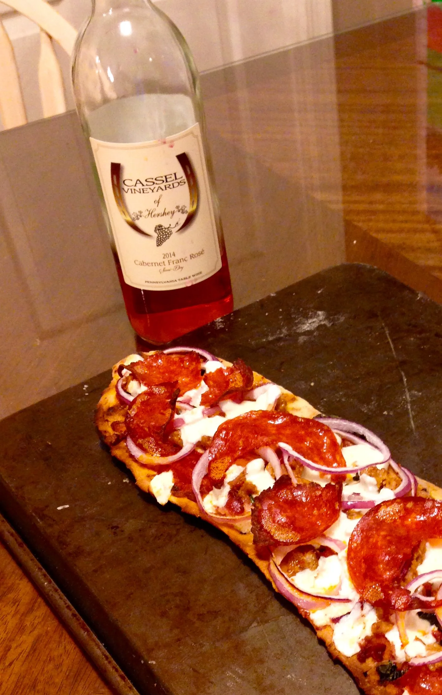 Kim and Adams grilled pizza pairs perfectly with our Cab Franc Rose'