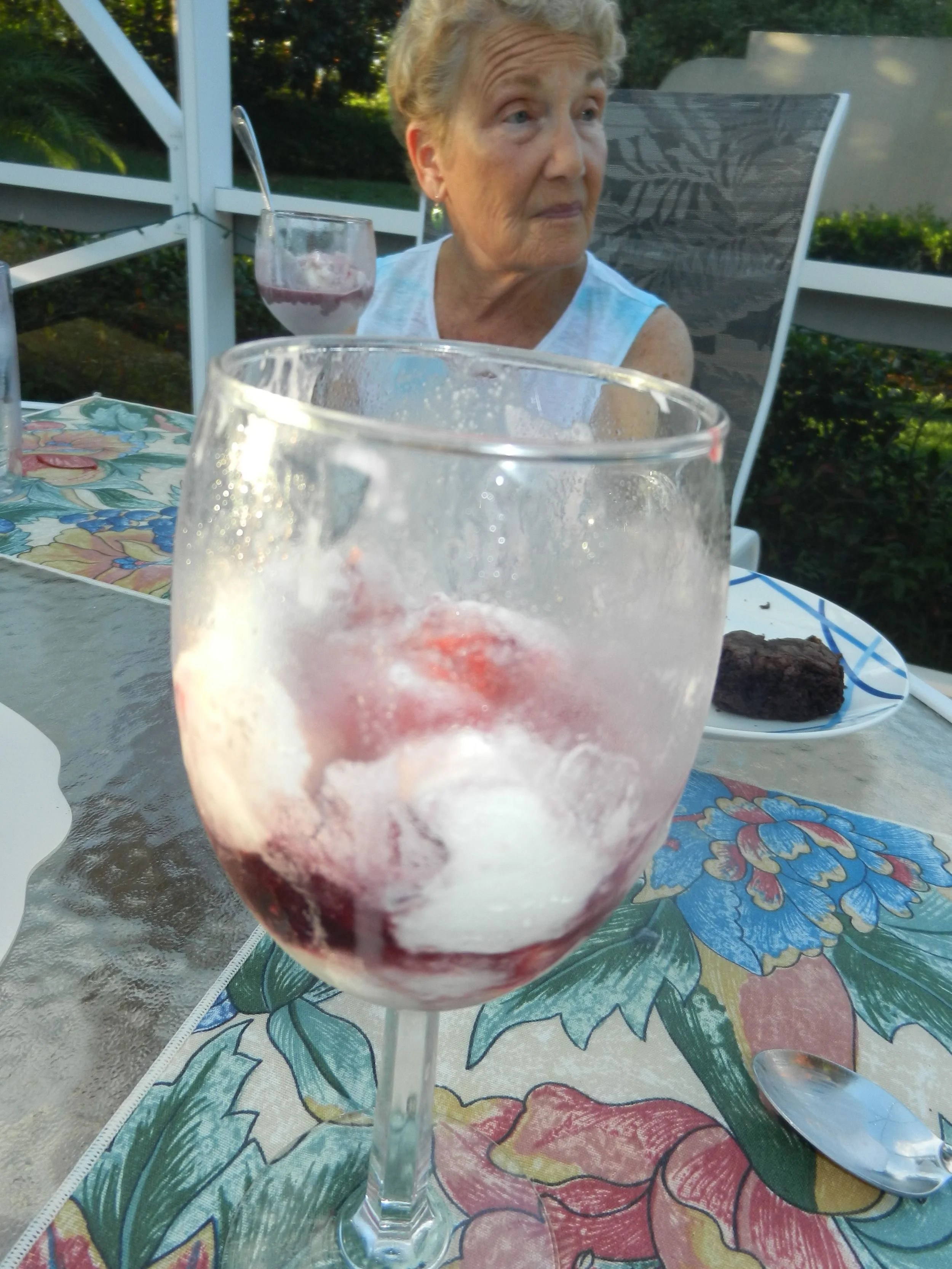 Vanilla swirl ice cream with a shot of Cassel's Chocolate Ruby Royale and a maraschino cherry.
