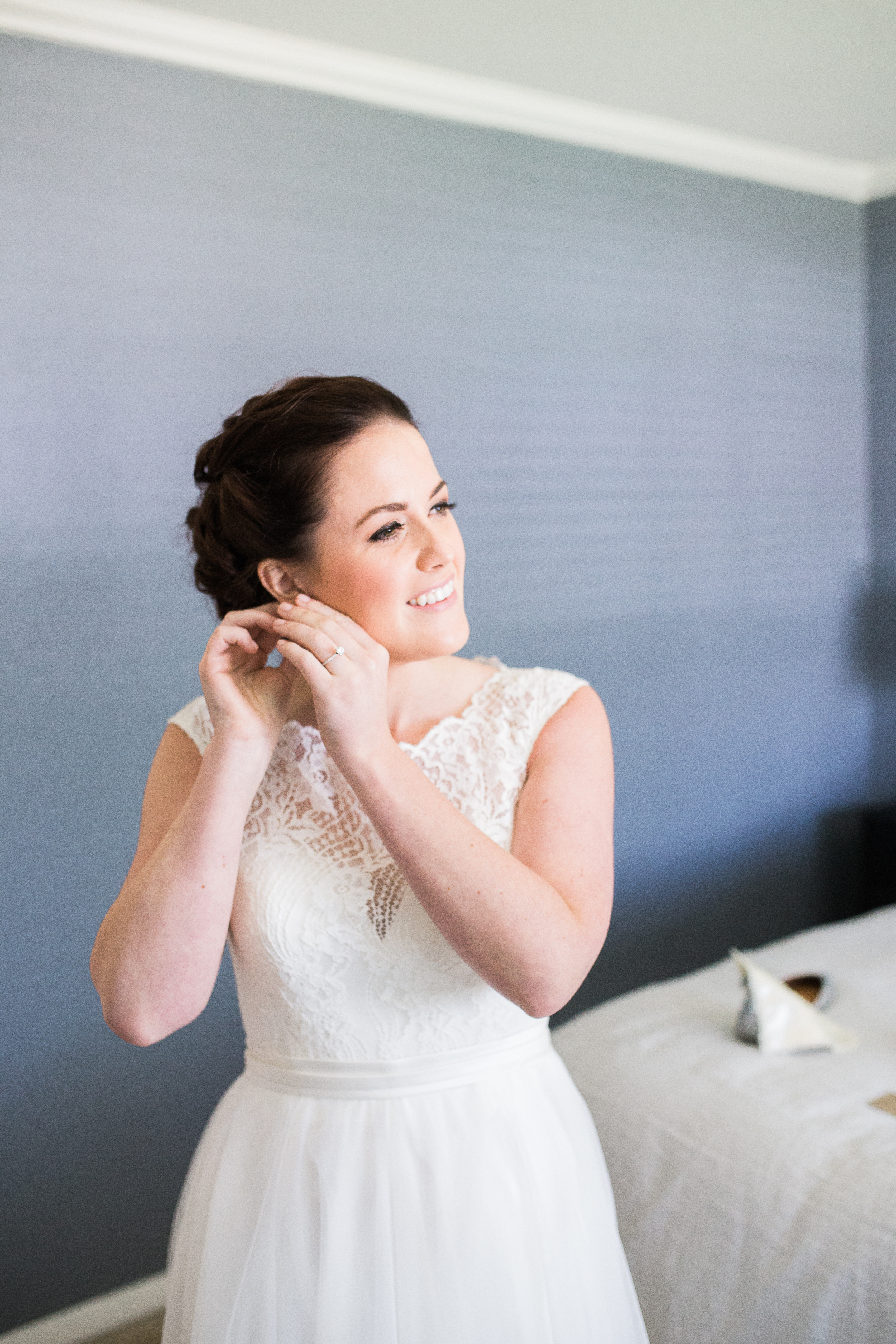Coohills Wedding Photographer - bride putting on earrings