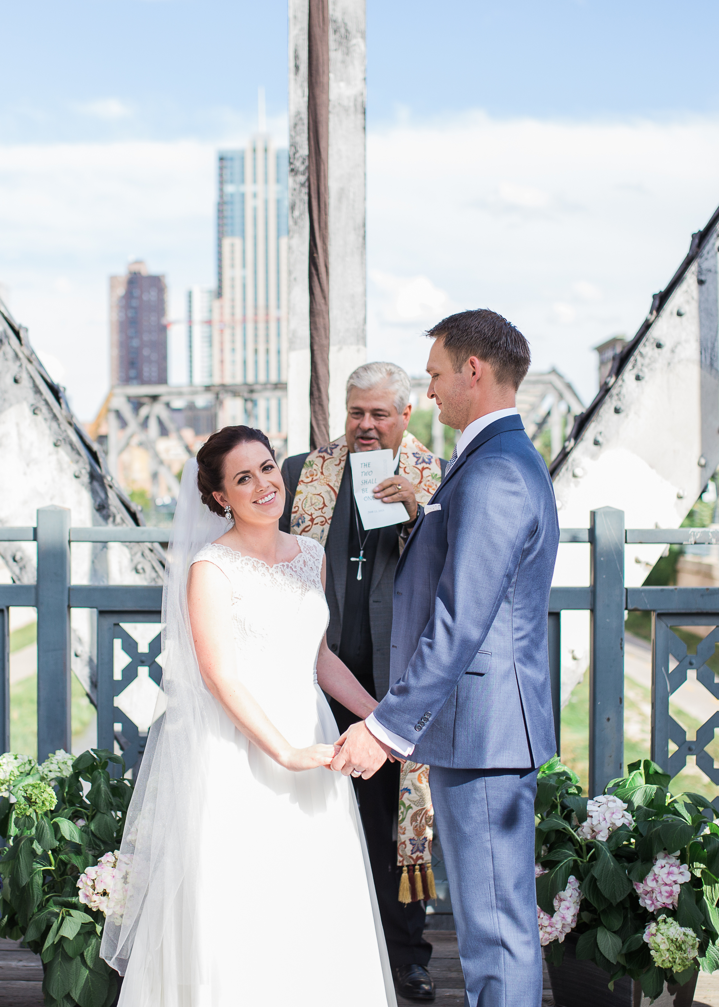 Coohills Wedding Photographer - bride and groom during ceremony on bridge