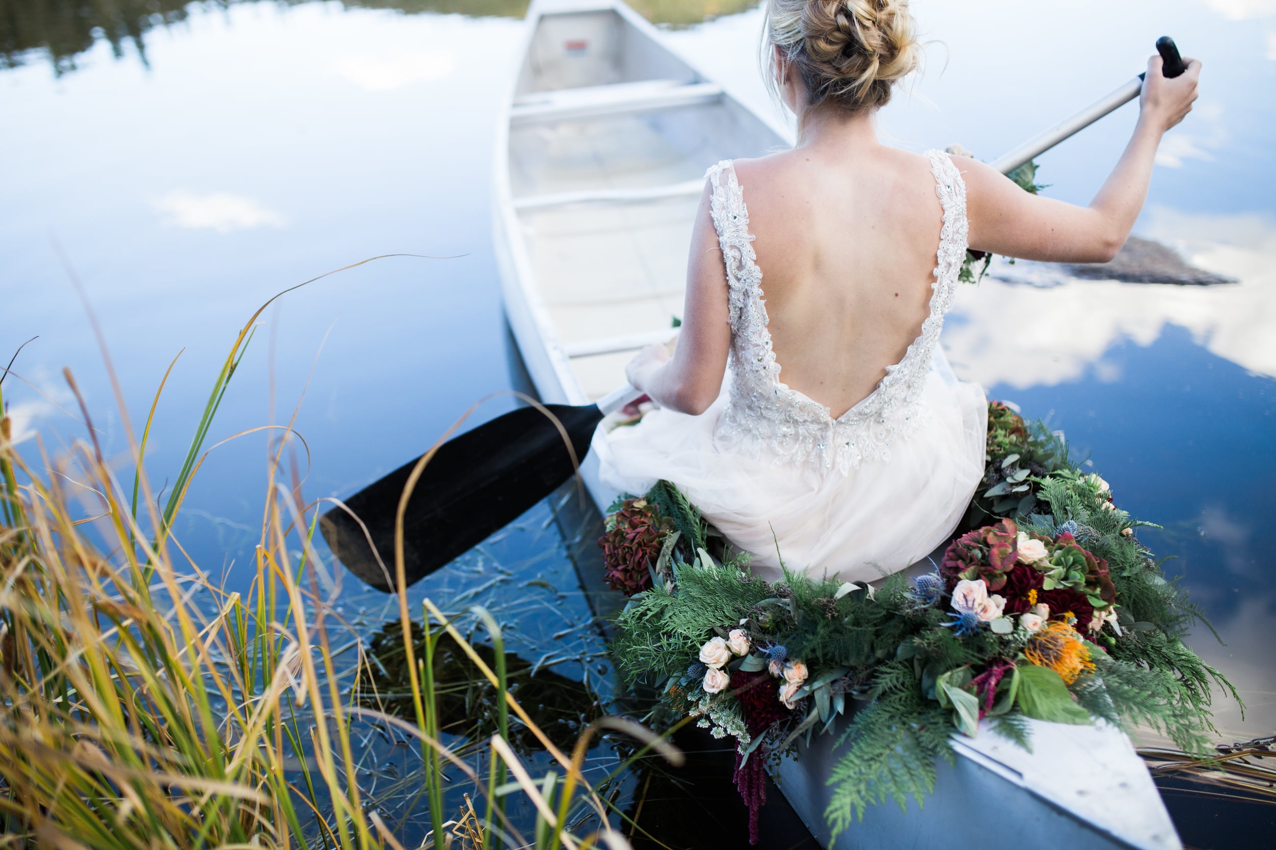 Colorado Mountain Wedding Photographer - bride on canoe