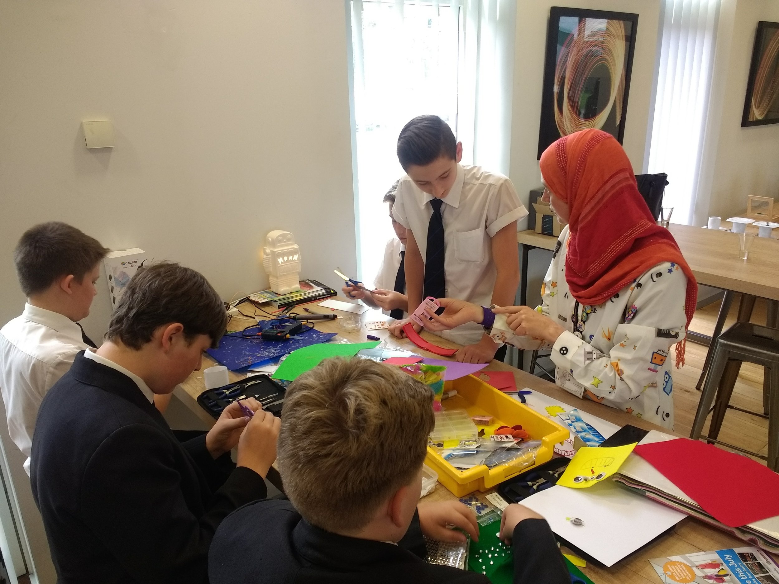 Alison helping the students to make LED light up badges and keyrings