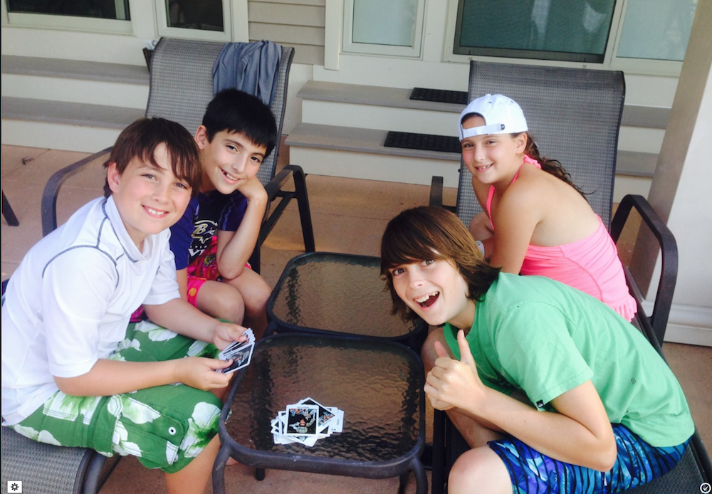four out of five of the miller & friedlander kids playing cards