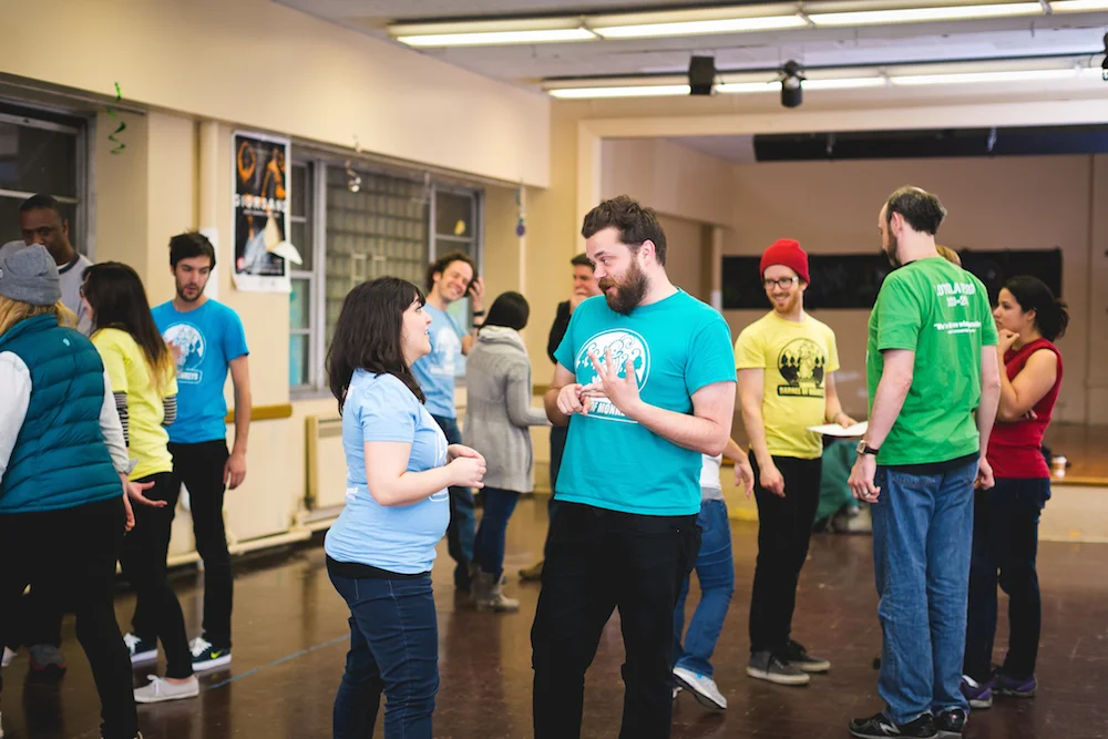 Levy, Schupbach, and other BOM members workshopping student plays