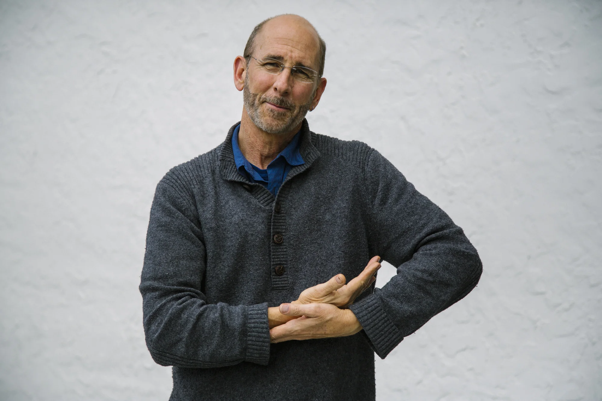 Bill white signing "baby" with american sign language