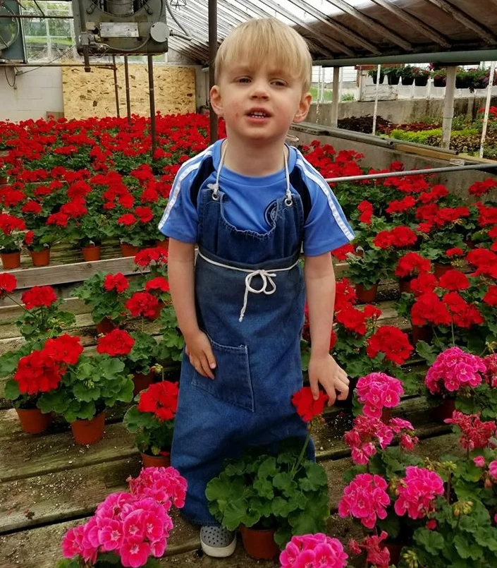 Evan's 3rd year as manager at Omaha's Florist supervising the beautiful flowers in the greenhouse.