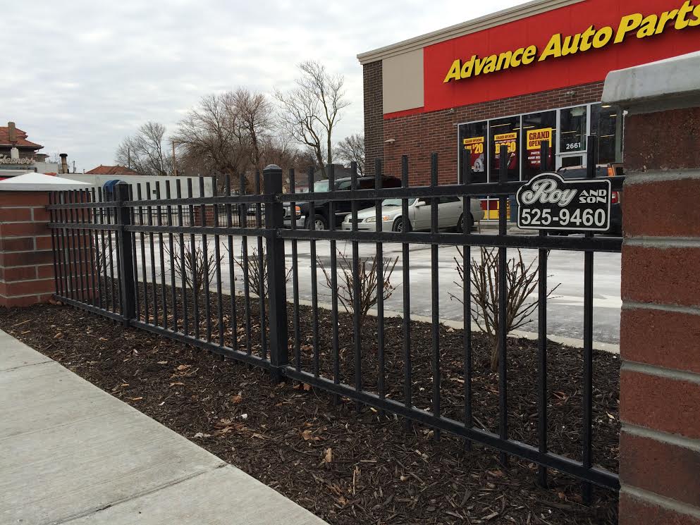 Roy and son fencing fence at advanced auto parts.jpg