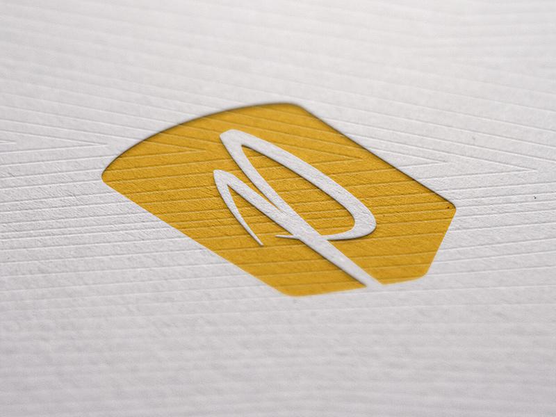 Secondary badge mark, letterpressed.