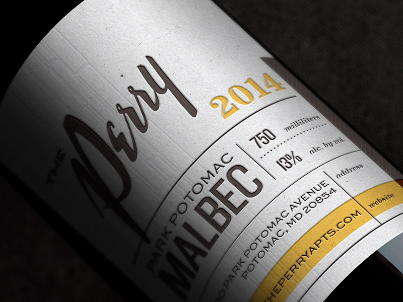 Branded wine bottle move-in gift label detail.