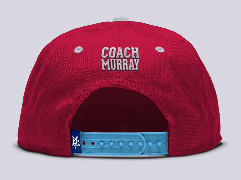 Coach's ball cap back with embroidered patch and sewn garment tag