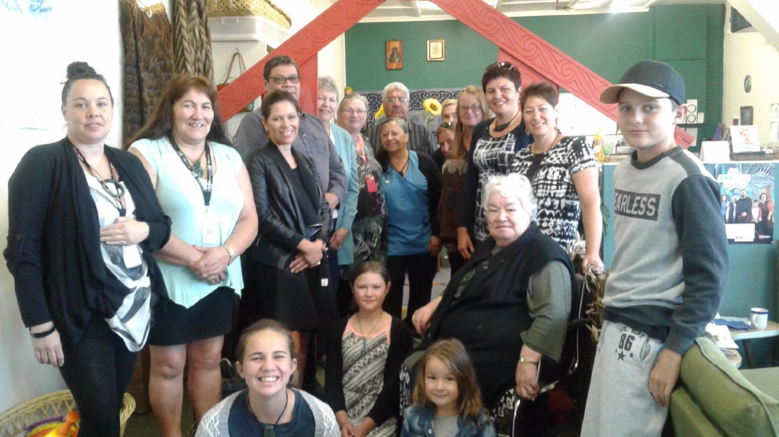 Gina-Lee (in black and white) with Richelle Schaper (in black and white) standing behind our beautiful kuia o Ngāti Apa k te Rā To, Barb Greer. Also in the photo is Carl Hutchby (Chief Executive of Poutini Waiora); Kathleen Gavighan (Manager of the Buller District Health Board) with other staff from Poutini Waiora and members of Te Ha o Kawatiri. You can also spot Matua Ned Tauwhare at the very centre back of the photo.