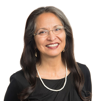 International Speaker, Jo Ann Kauffman As the President and Founder of Kauffman & Associates, Inc., Jo Ann Kauffman (Nez Perce) built the company from a one-woman shop into an organization that now employs more than 50 people in Spokane, WA; Washington, DC; and other locations across the country. Jo Ann is actively involved in all aspects of KAI operations and ensures that KAI clients receive high-quality management support. Jo Ann is certified in facilitation and consultation on public and behavioral health topics. Jo Ann grew up in Seattle, WA, and on the Nez Perce Reservation in Kamiah, ID. After working to advance Indian health care, including serving as executive director of the Seattle Indian Health Board, Jo Ann founded KAI in 1990. Jo Ann holds a master’s degree in public health from the University of California at Berkeley. Jo Ann was honored by Business Beat as Minority Small Business Person of the Year 2006 and as owner of the Fastest Growing Minority Business in 2004, 2007 and 2008. In 2015, the Spokane YWCA awarded her the Women of Achievement Carl Maxey Racial & Social Justice Award. Jo Ann serves on the Board of Trustees at Eastern Washington University (EWU) and leads Advisory Committee of the new Lucy Covington Center at EWU. Lucy was a political activist from the Colville Confederated Tribes who fought to save her land and people. The Center at EWU was created to establish a permanent legacy for Lucy Covington and her groundbreaking work to secure the unique and important status of tribal governments. In 2017, Eastern Washington University awarded Jo Ann an honorary doctorate. The Gannett Freedom Forum awarded Jo Ann its Free Spirit Award in 1998 to honor her longtime community activism and advocacy for First Amendment rights.