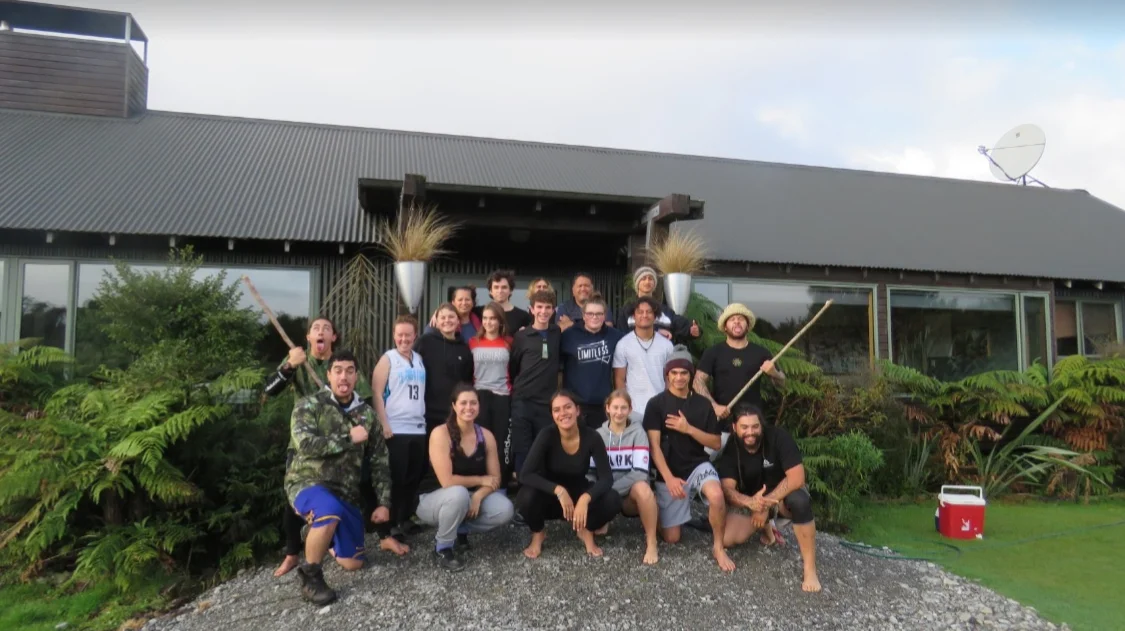 Rangatahi and Manuhiri outside of the Martins Bay lodge.