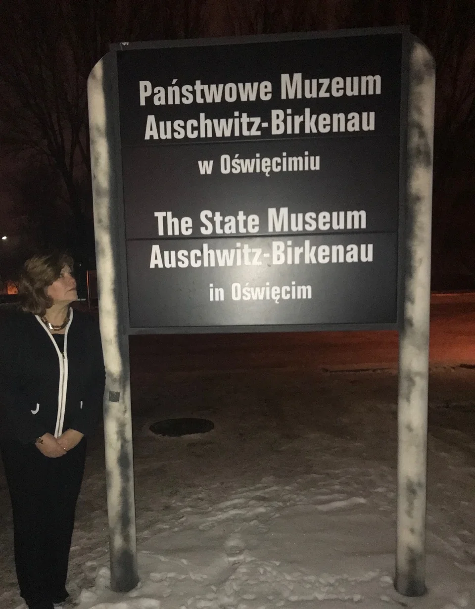 Nancy Presenting at Auschwitz night sign.jpeg