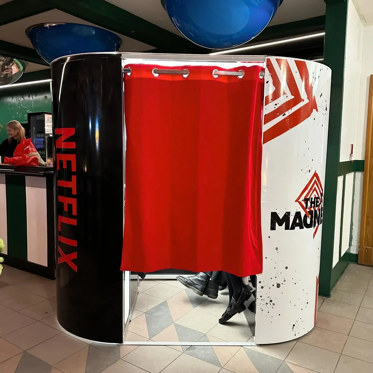 Booth wrapped in Netflix branding: Snaptique Classic photo booth fully wrapped in Netflix branding at The Madness wrap party in Toronto