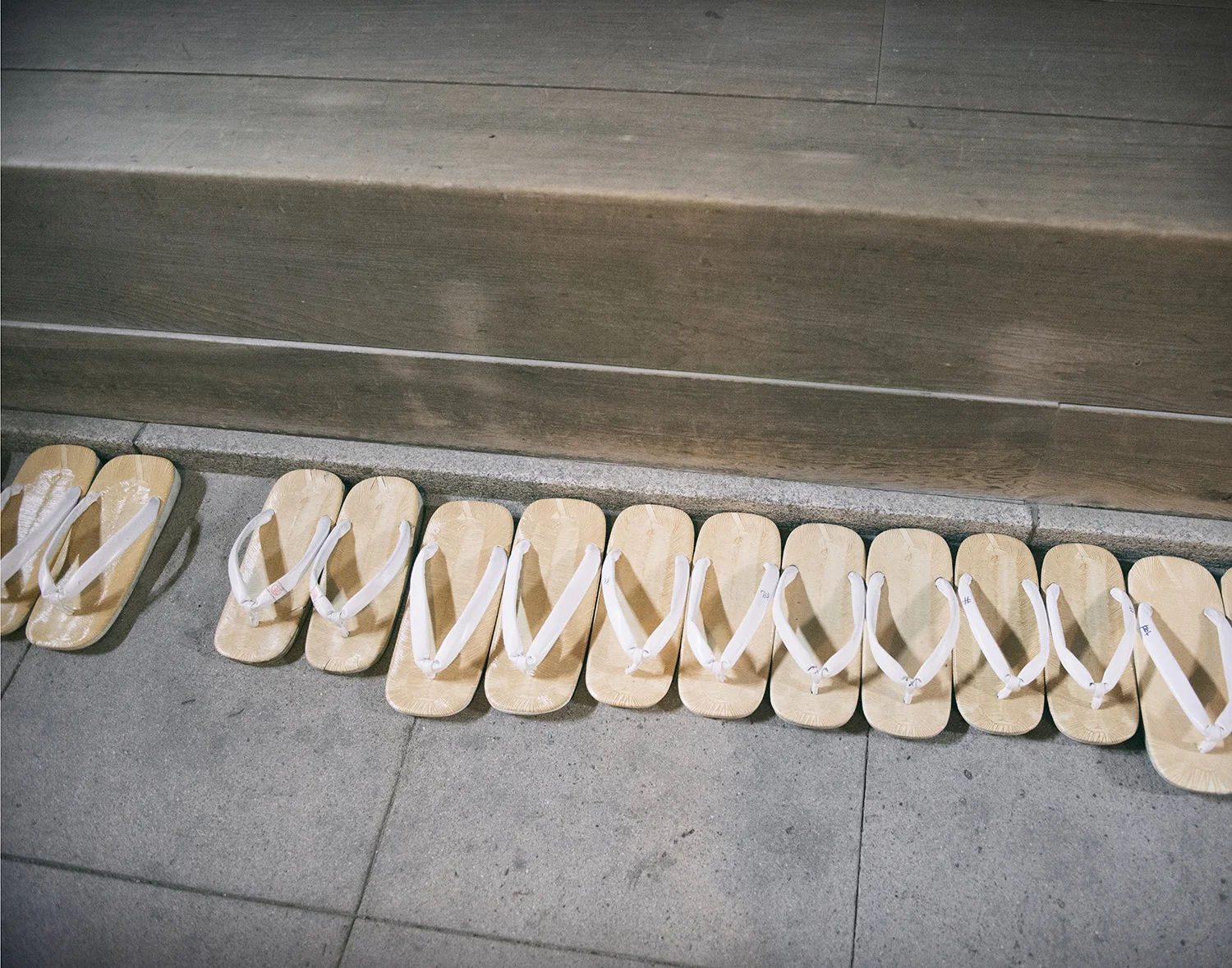 Zouri sandals lined up inside the shrine.