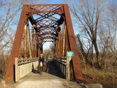 An old truss bridge reminds us it was once a rail line
