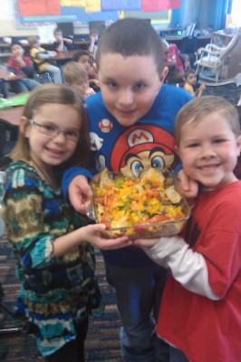 Showing off the "bike49" veggie nachos they made