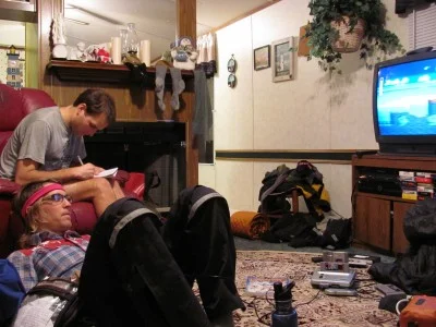 Aaron and Tommy play video games in this spare trailer
