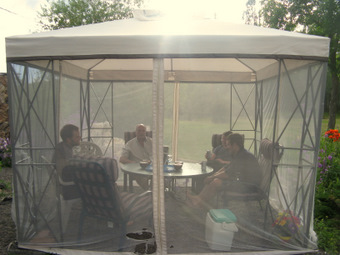 Keith hooks us up with a bug net, garden salads, beer, and company.