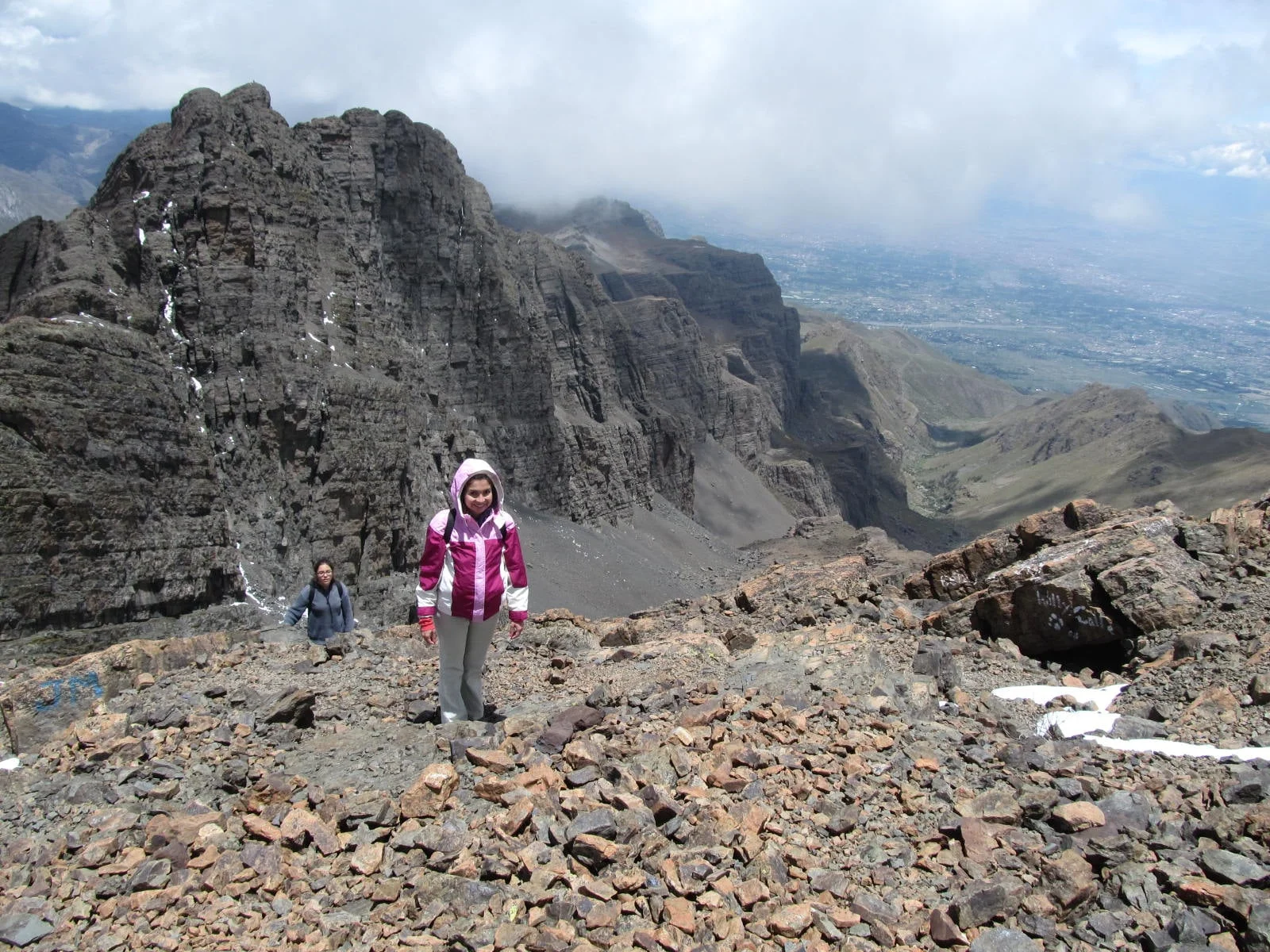 Eliana and Nati just moments from the top of mountain Tunari with inspiring views of layers of mountains in much missed silence.