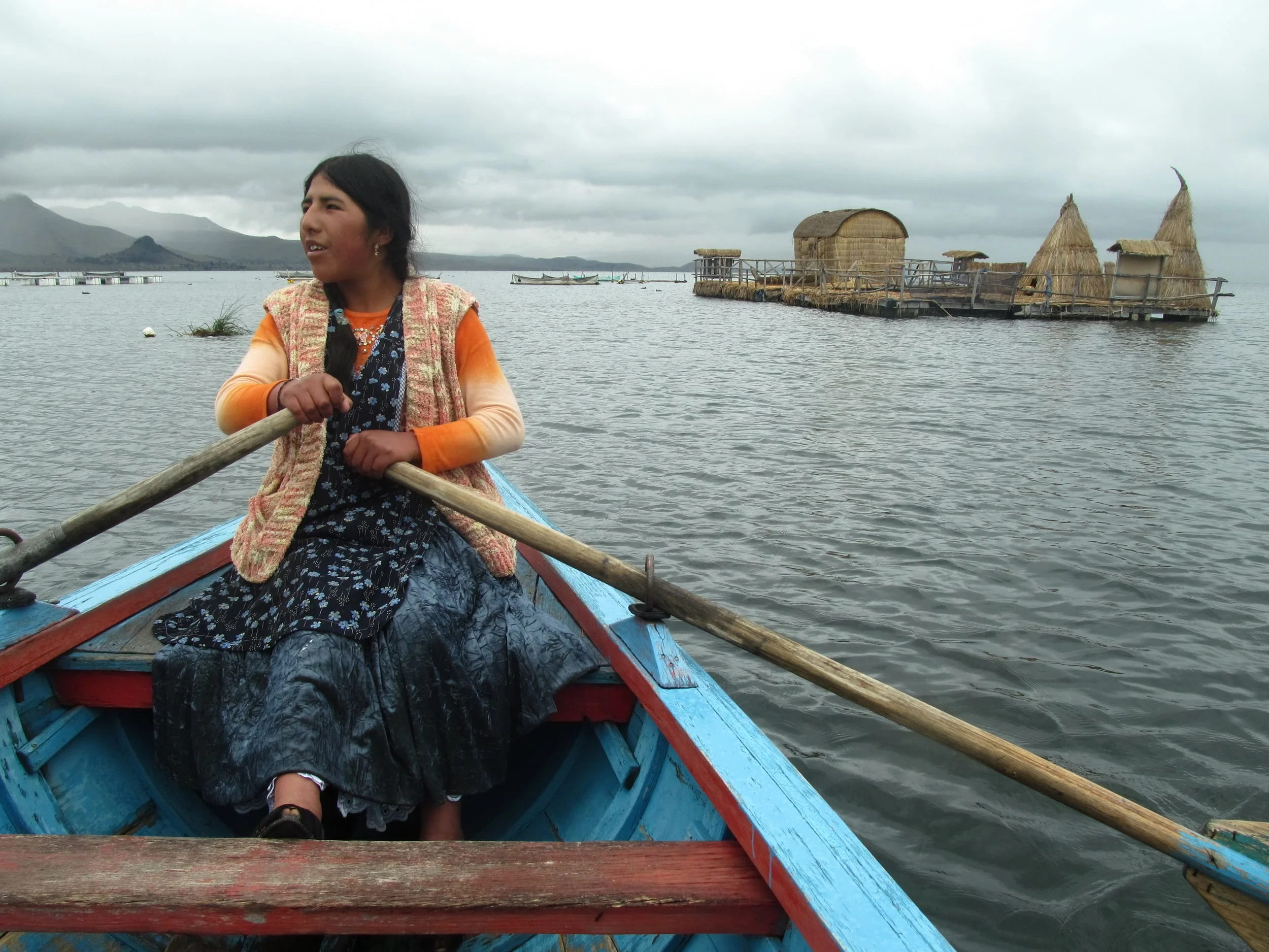 This women paddles us out to the grass island, which displays information on the water frog, a species found only in Lago Titicaca and threatened with extinction.