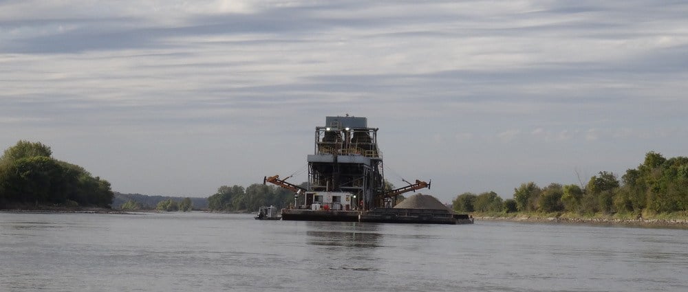Instead of sandbars in the middle of the river now we find sand dredges!