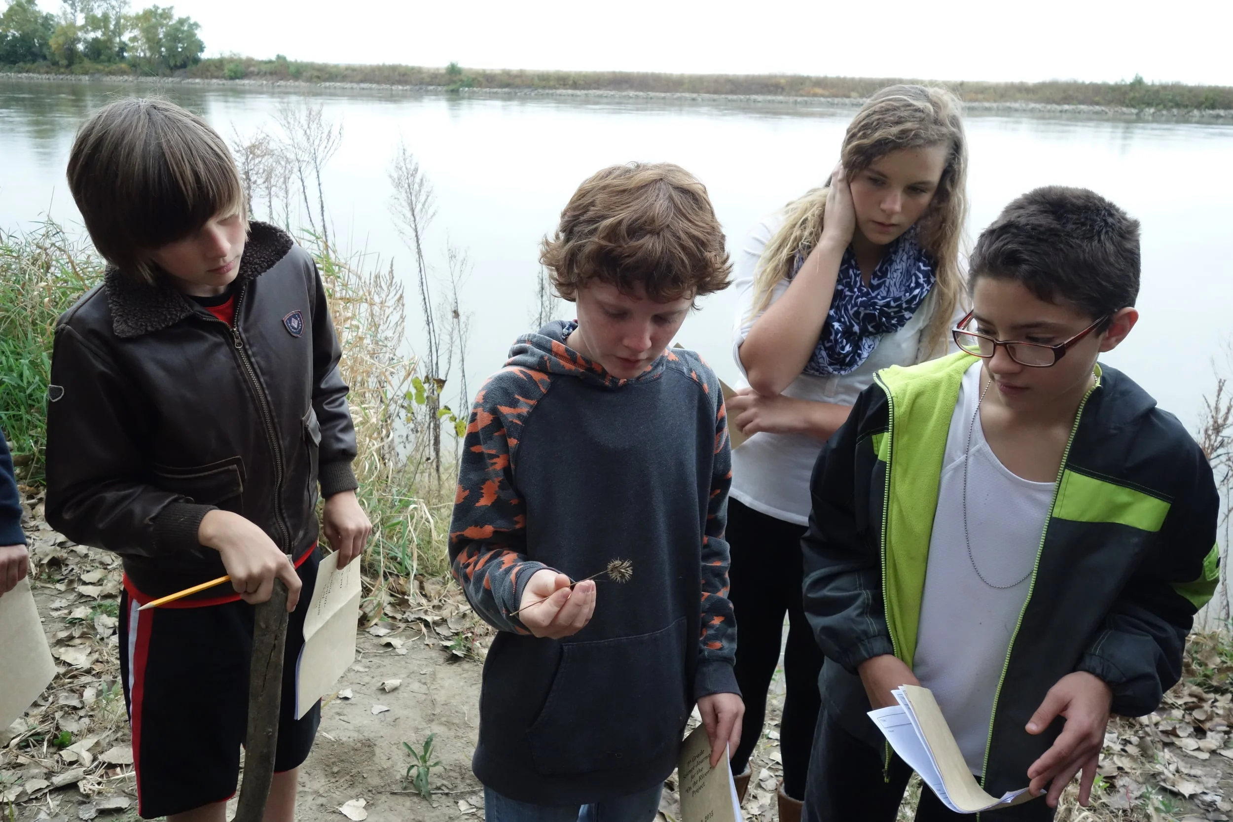 Seventh graders explore the riparian zone looking for plants and animals adapted to living near water.
