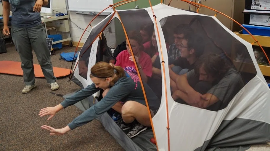 Our Presentation included stories, photos and hands on experience with our gear. While some kindergarten classes managed to fit 15 kids in the tent, these eighth graders only managed 8.